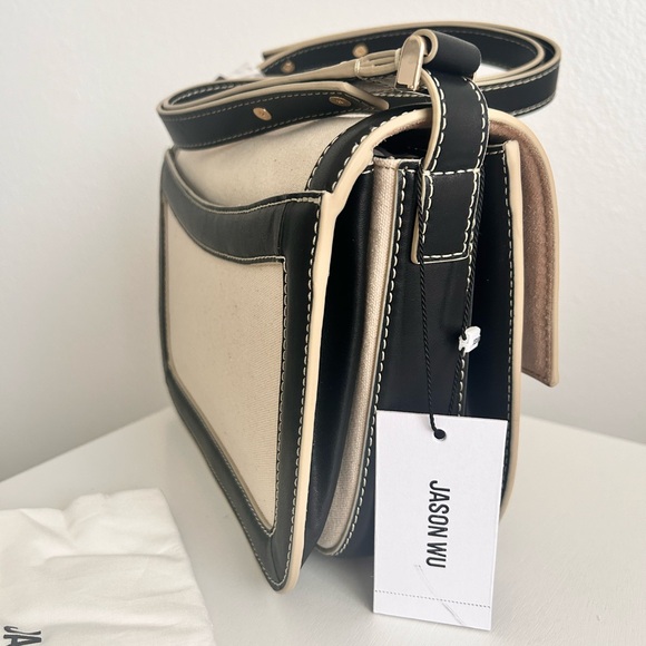 Jason Wu
Orbit Canvas / Leather Shoulder Bag NWT Color Beige/ Black - Picture 10 of 14